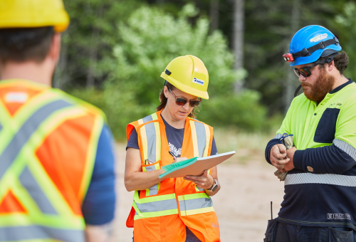 Three people wearing safety equipment